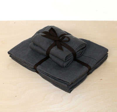 folded stack of 100% linen powder room towel set hand towels wash cloths heavyweight Orkney linen fabric antimicrobial fast drying charcoal dark grey color