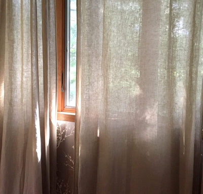 window with 100% linen curtains smooth airy lightweight linen slightly sheer natural un-dyed beige tan color