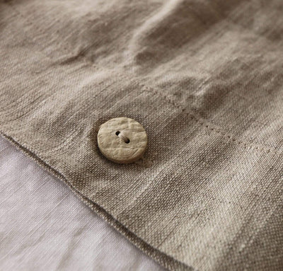 all natural un-dyed flax linen bedding with natural coconut button closure.