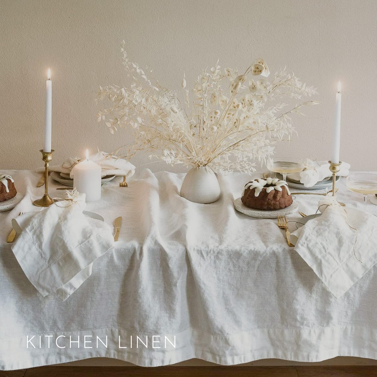 Off-white linen tablecloth and napkins on a candlelit holiday table — Kitchen Linen
