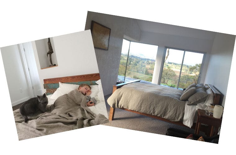young boy and his pet cat snoozing together on linen sheets.
