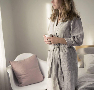 woman wearing 100% linen bathrobe unisex robe mid-weight St. Barts linen fabric un-dyed natural taupe beige color