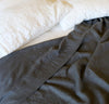 white and charcoal grey summer bed with 100% linen sheets and summer cover - light linen blanket