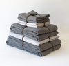folded stack of 100% linen king bed linen set bed-in-a-bag duvet cover pillow shams bedskirt summer cover sheets charcoal dark grey off-white white colors