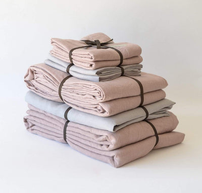 folded stack of 100% linen king bed linen set bed-in-a-bag duvet cover pillow shams bedskirt summer cover sheets natural light brown beige tan rose light pink blush color