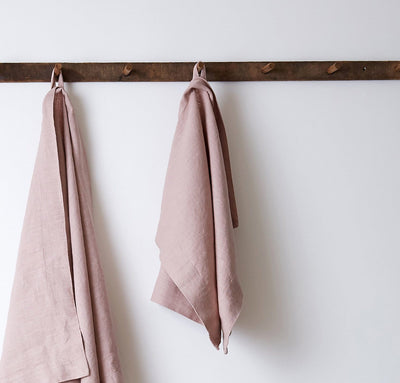 bathroom scene of hanging 100% linen hand towel heavyweight Orkney linen fabric antimicrobial fast drying rose light pink blush color