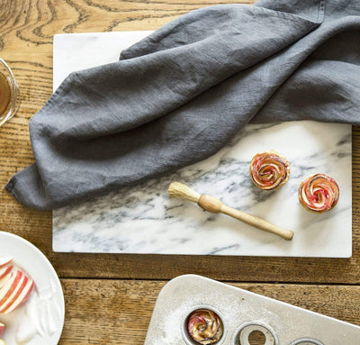 charcoal grey linen kitchen towel with mini apple rose tarts. fine linen tea towel dark gray