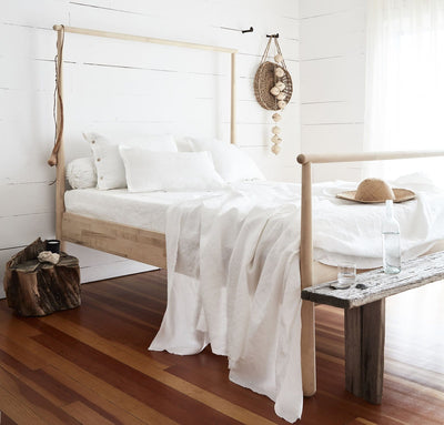 bedroom scene with 100% linen summer cover blanket with frayed raw edge detail pure white color