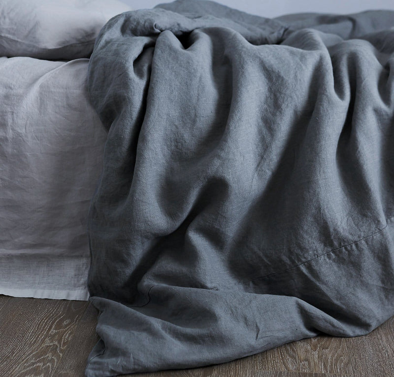 bedroom scene with 100% linen duvet comforter cover smooth texture mid-weight St. Barts linen fabric twin queen king calking sizes ink navy color